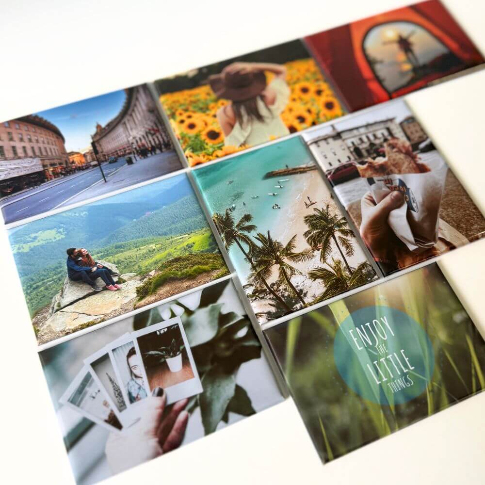 Image shows a flat lay of a set of eight rectangle photo magnets. Each magnet displays variety in what could be applied to a magnet from travel to food to quotes.